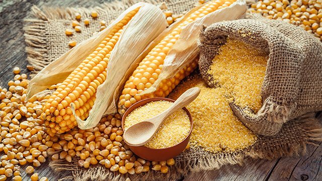 Corn_groats_and_seeds_corncobs_on_wooden_rustic_table